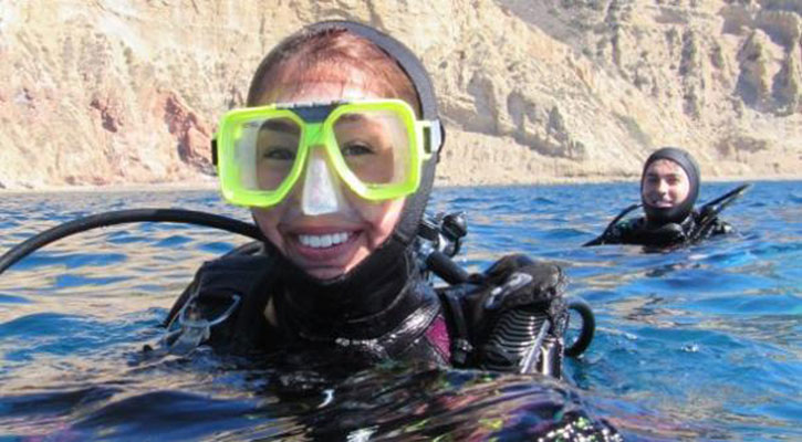 two divers on surface of ocean