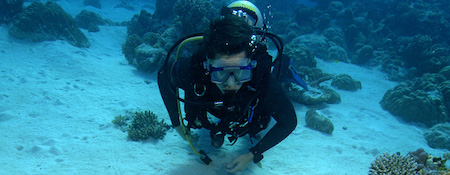 scuba diver in the water with out stretched arms