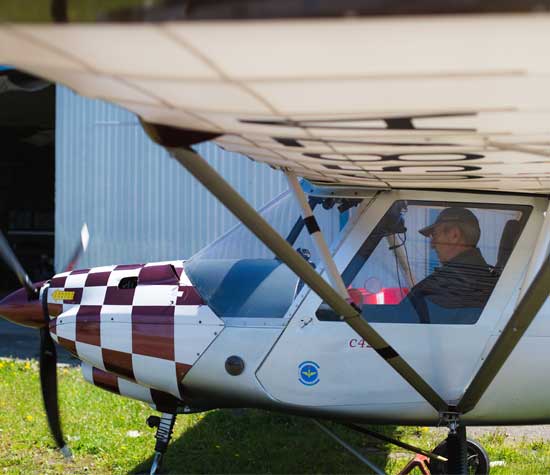 man getting ready to fly crop plane