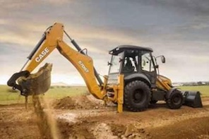 A CASE backhoe loader digs into dirt on an open construction site under a cloudy sky, with soil pouring from its bucket.