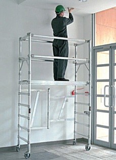 man standing on scaffolding