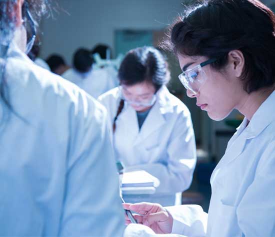 UCSB Students working in lab wearing PPE gear