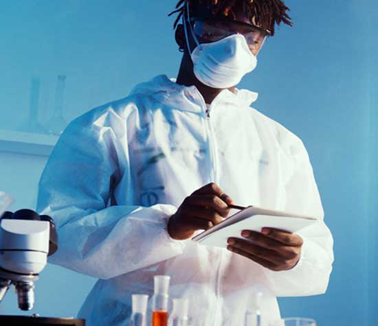 lab worker writing down steps